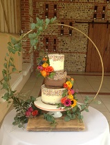 Semi naked wedding cake chocolate & sprinkles fresh flowers